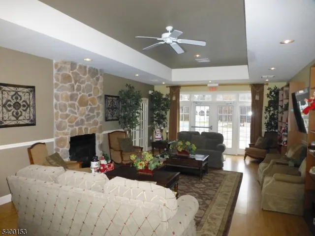 a living room with furniture fireplace and flat screen tv