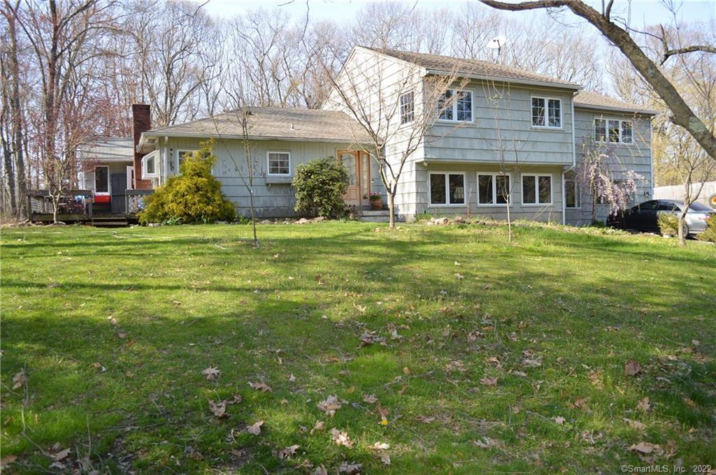 7 Midwood Road Norwalk, CT 06851 - Photo 1 of 1 a front view of a house with a garden