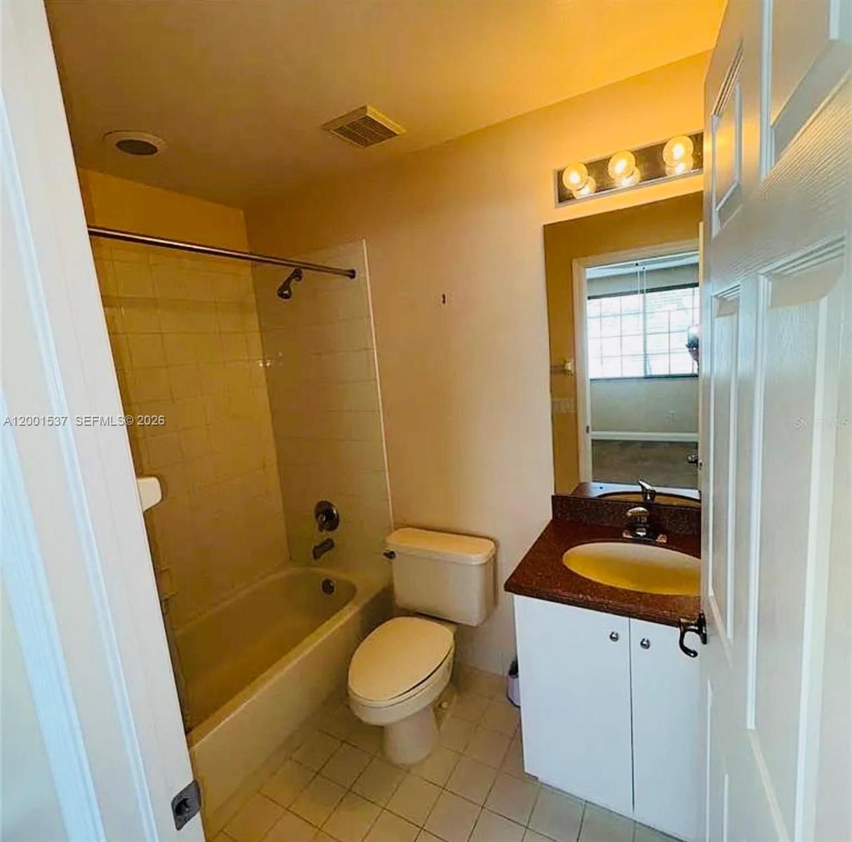 151 Coconut Key Lane Delray Beach, FL 33484 - Photo 12 of 21 a bathroom with a sink a toilet a mirror and shower