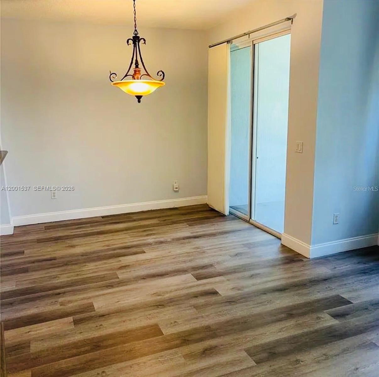 151 Coconut Key Lane Delray Beach, FL 33484 - Photo 3 of 21 a view of a room with wooden floor and windows