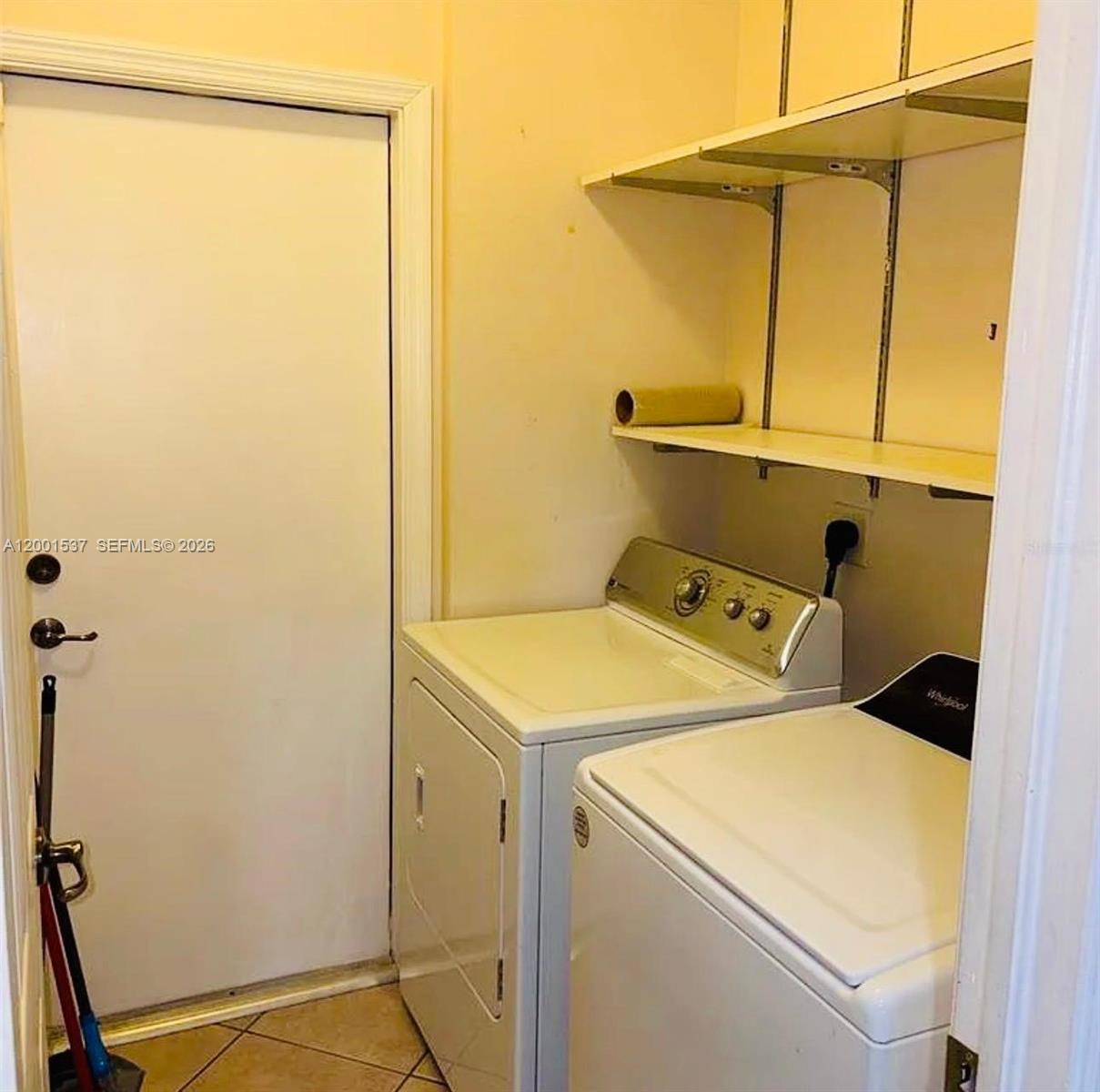 151 Coconut Key Lane Delray Beach, FL 33484 - Photo 7 of 21 a utility room with dryer and washer