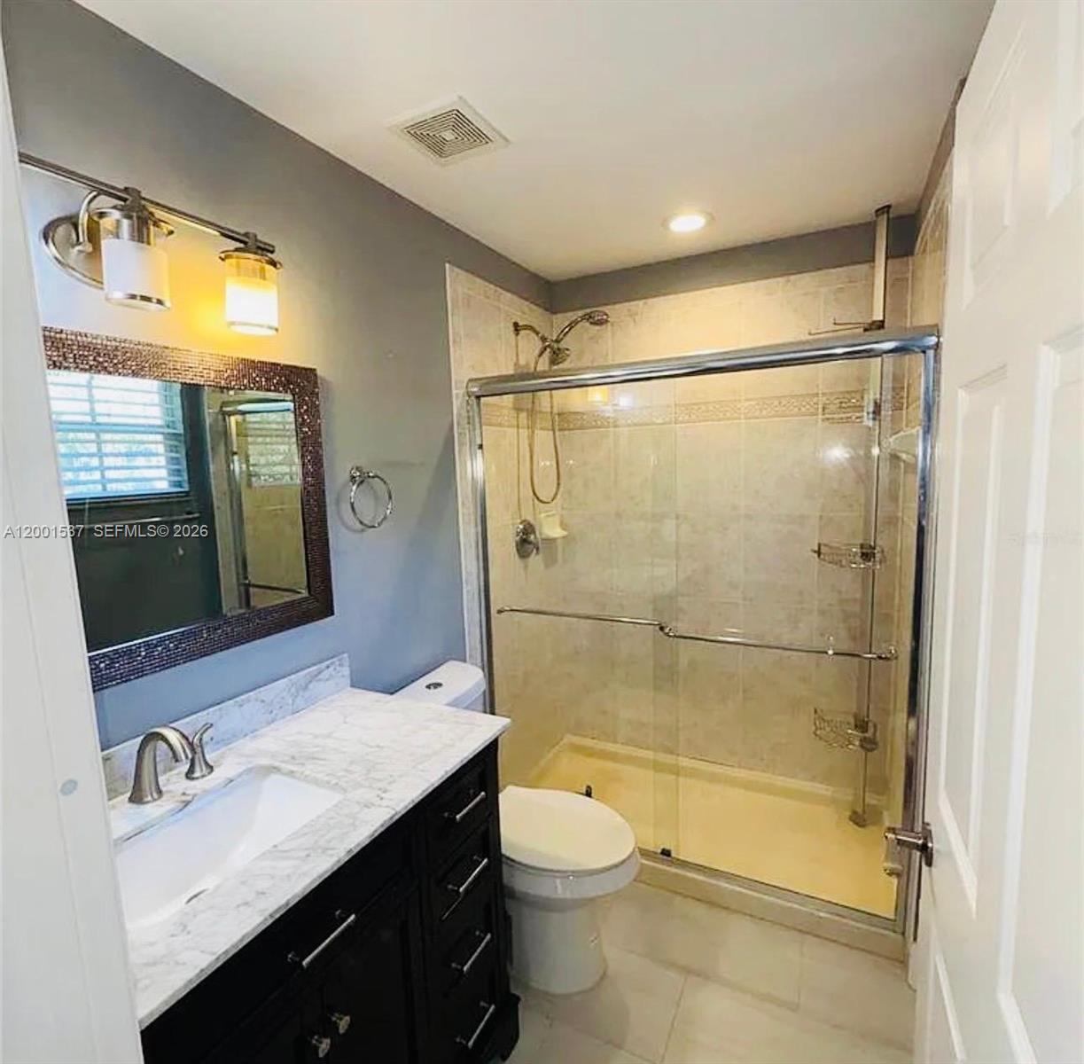 151 Coconut Key Lane Delray Beach, FL 33484 - Photo 10 of 21 a bathroom with a granite countertop sink toilet and shower