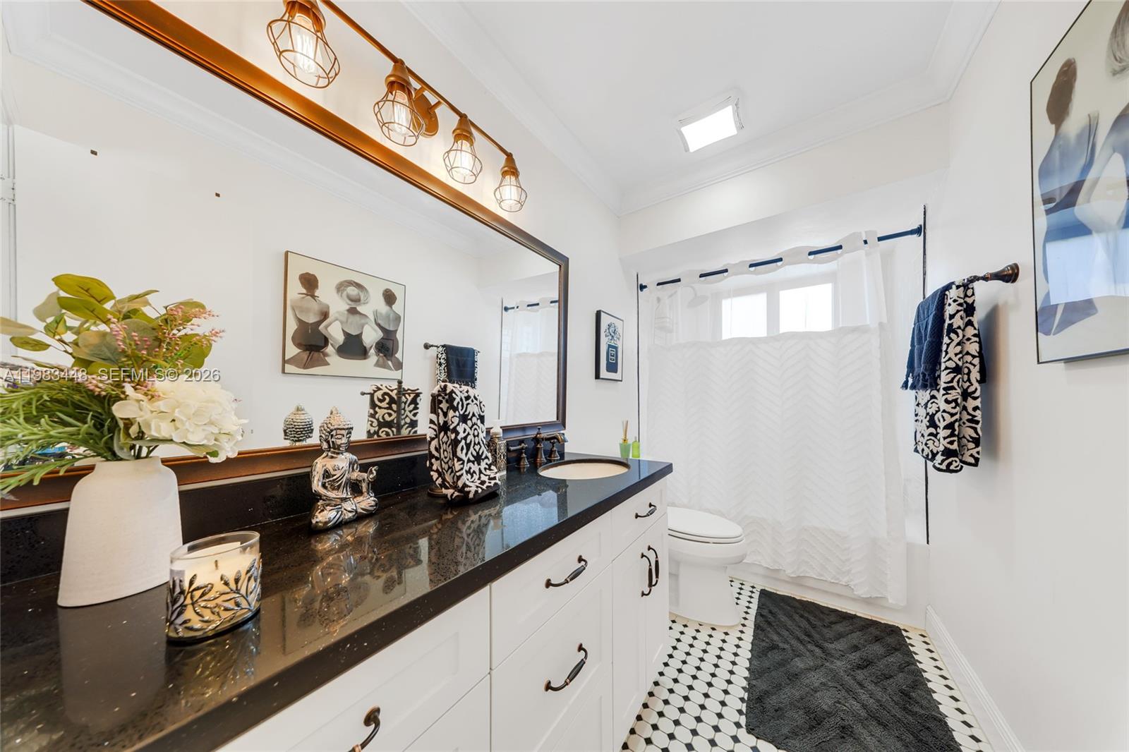 13951 Southwest 109th Street Miami, FL 33186 - Photo 16 of 34 a bathroom with a sink a toilet and mirror