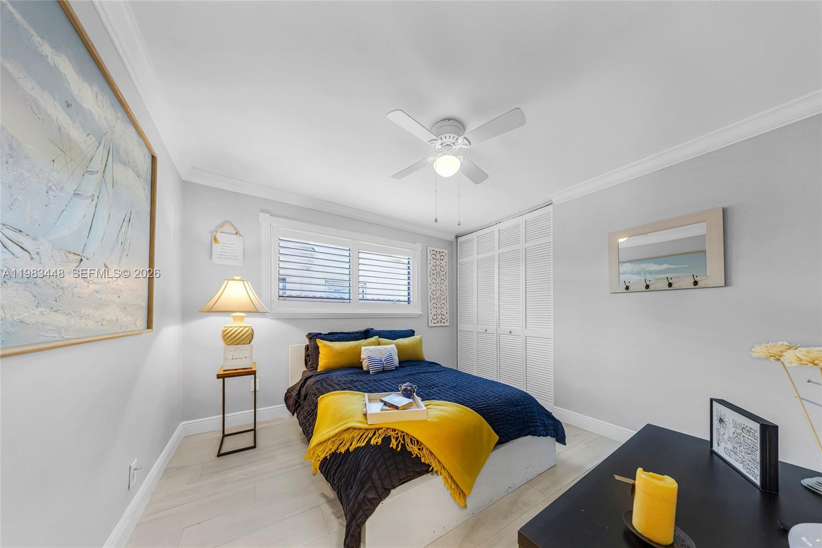 13951 Southwest 109th Street Miami, FL 33186 - Photo 17 of 34 a bed room with a bed and a chandelier