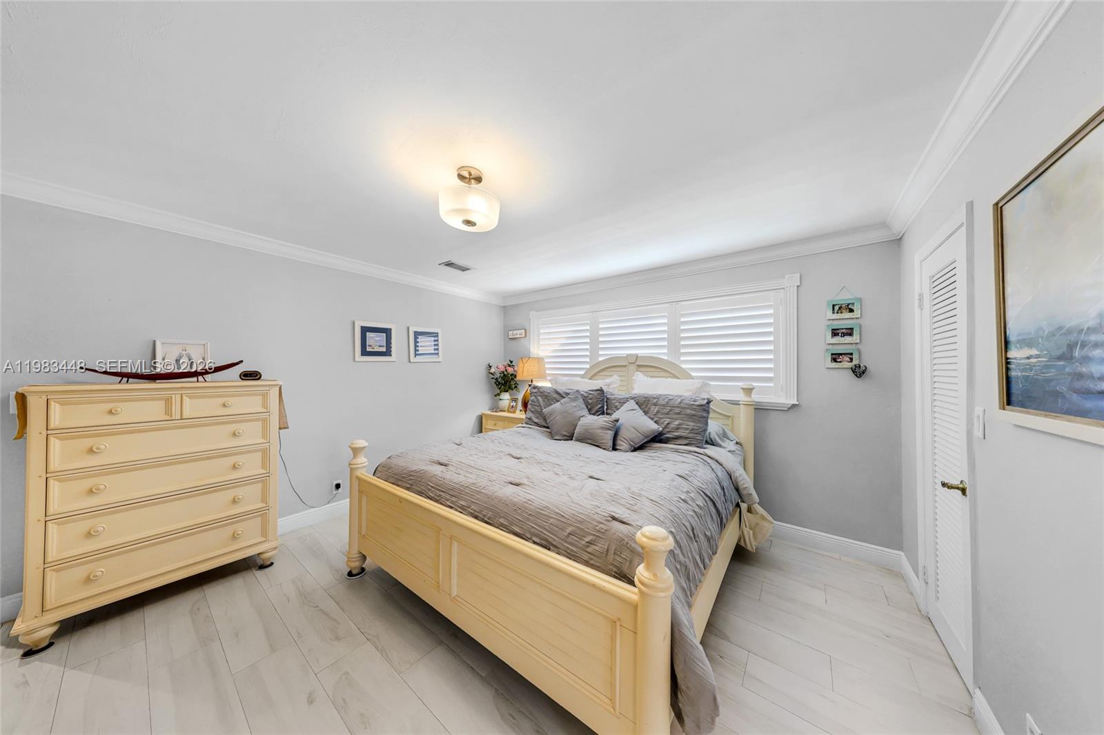 13951 Southwest 109th Street Miami, FL 33186 - Photo 23 of 34 a bed room with a bed and a window