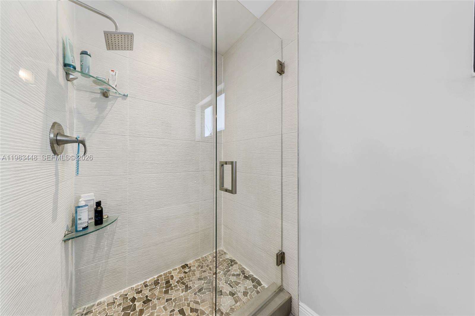 13951 Southwest 109th Street Miami, FL 33186 - Photo 25 of 34 a bathroom with a shower