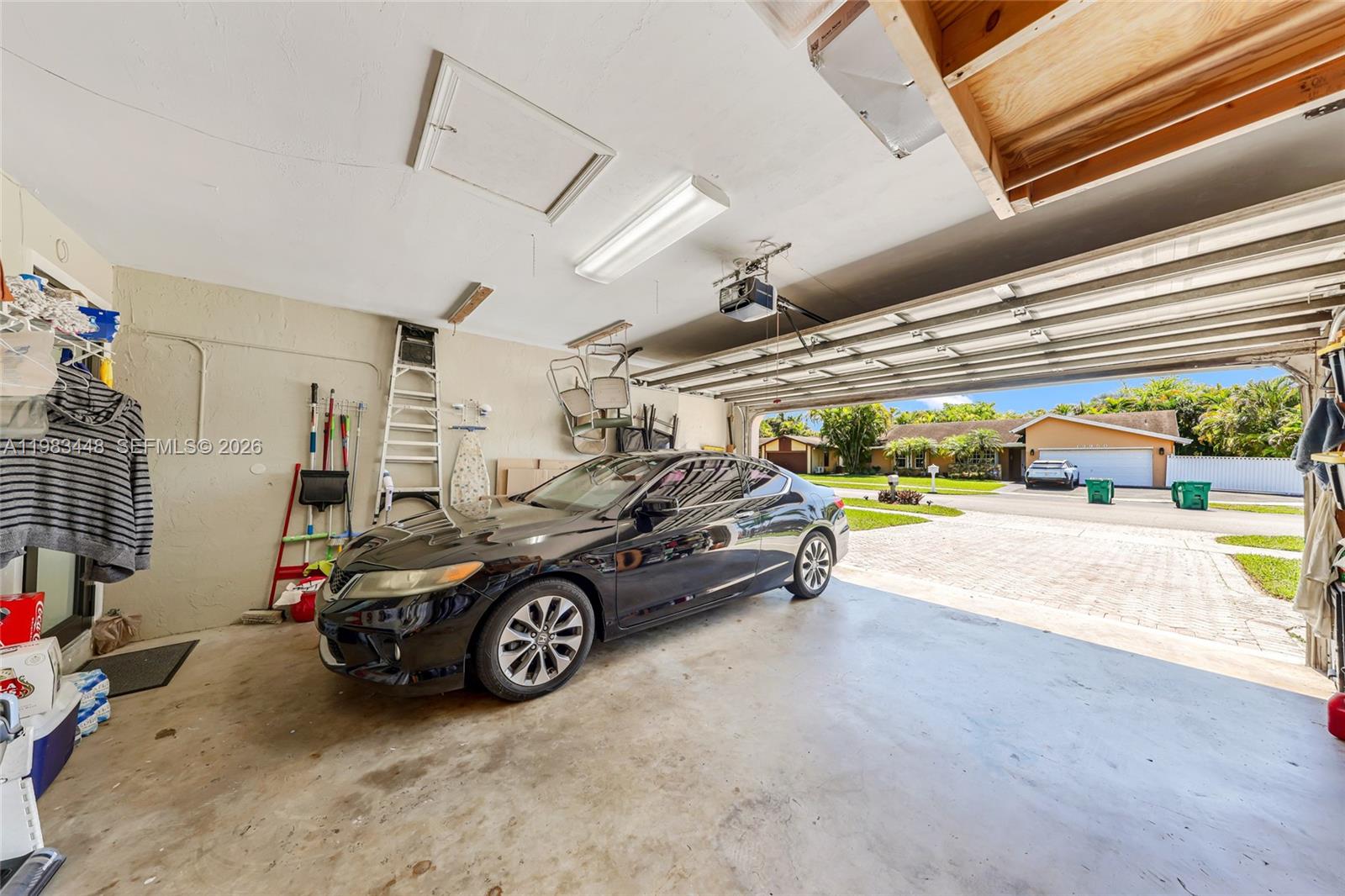 13951 Southwest 109th Street Miami, FL 33186 - Photo 28 of 34 a car parked in garage