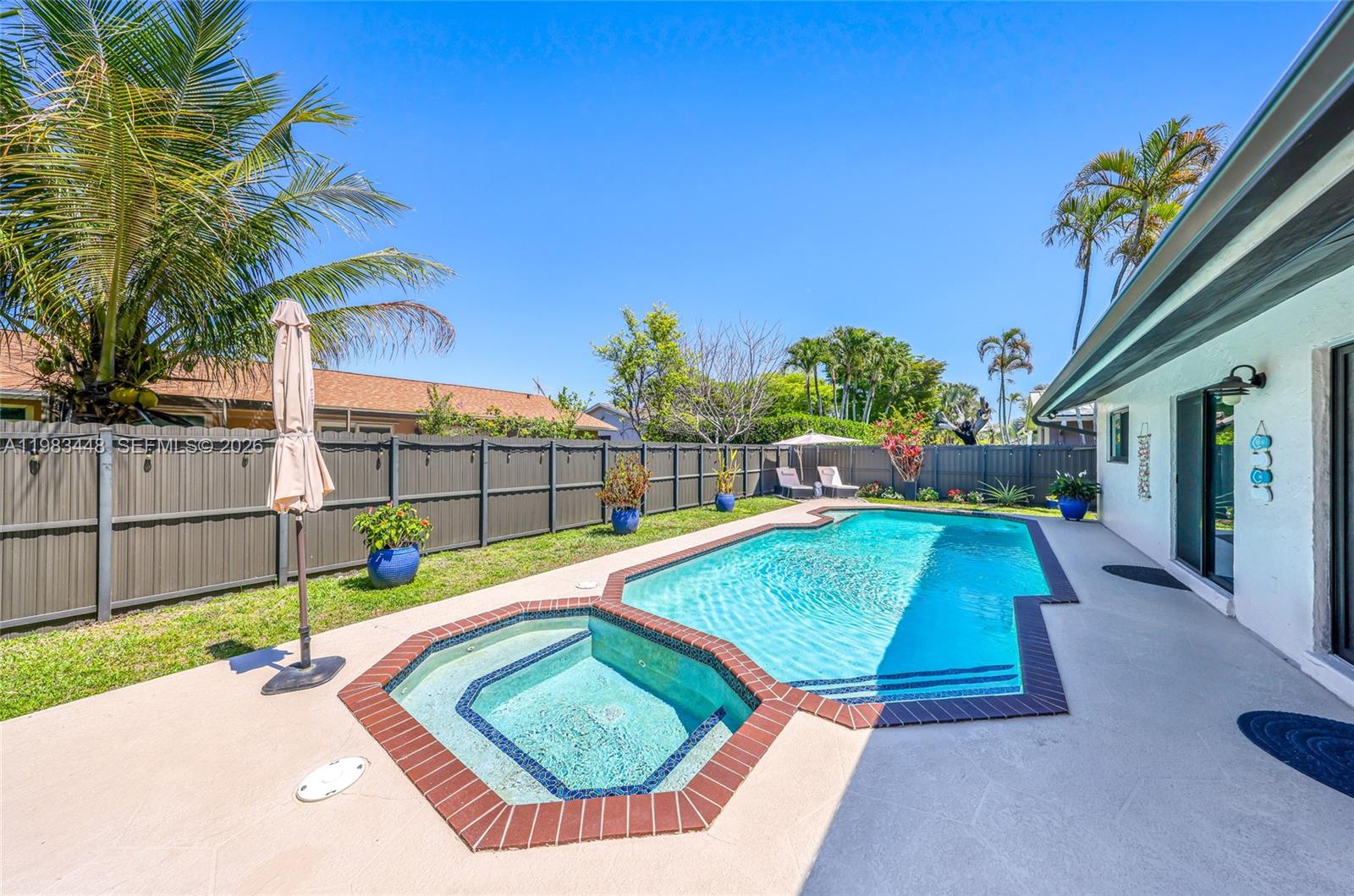 13951 Southwest 109th Street Miami, FL 33186 - Photo 29 of 34 a view of a backyard with swimming pool
