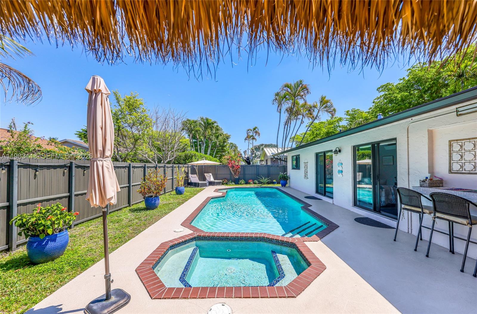 13951 Southwest 109th Street Miami, FL 33186 - Photo 31 of 34 swimming pool view with a seating space