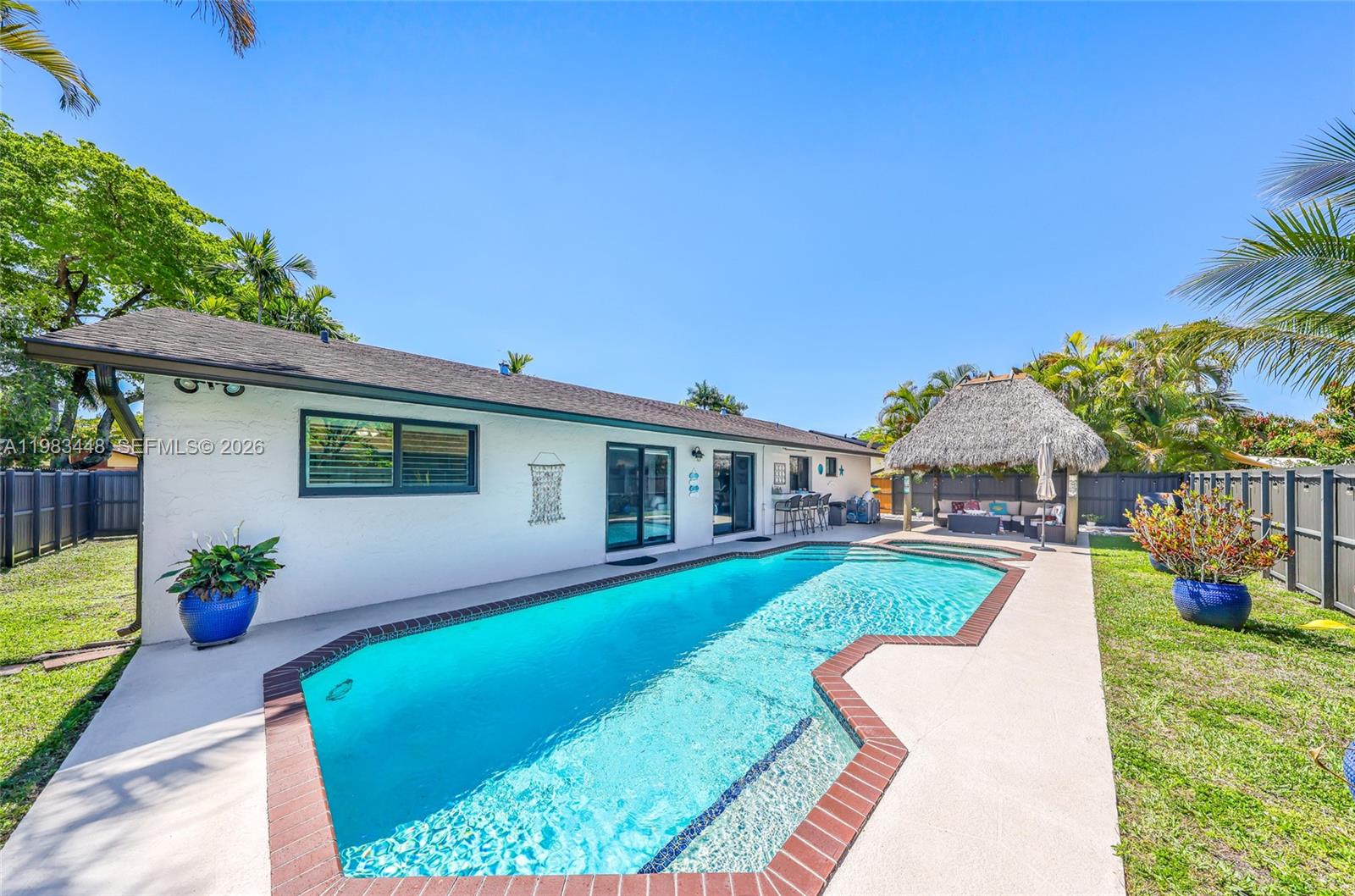 13951 Southwest 109th Street Miami, FL 33186 - Photo 33 of 34 a front view of a house with garden