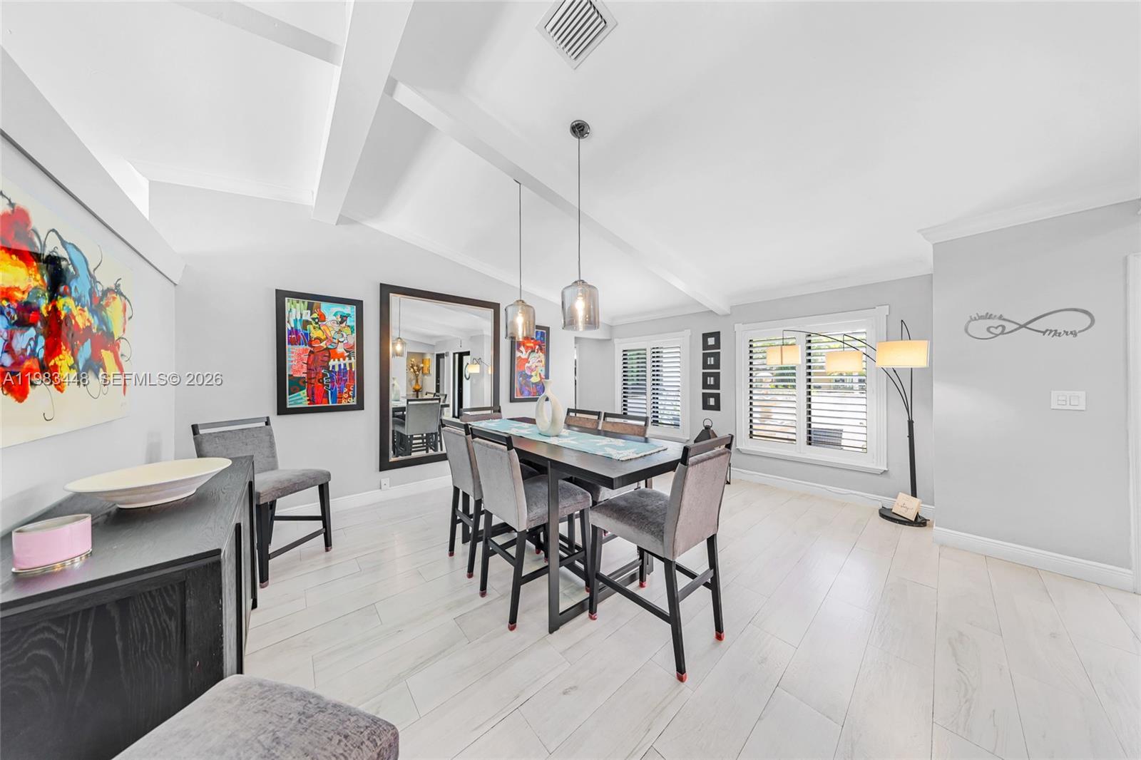 13951 Southwest 109th Street Miami, FL 33186 - Photo 4 of 34 a view of a dining room with furniture window and wooden floor