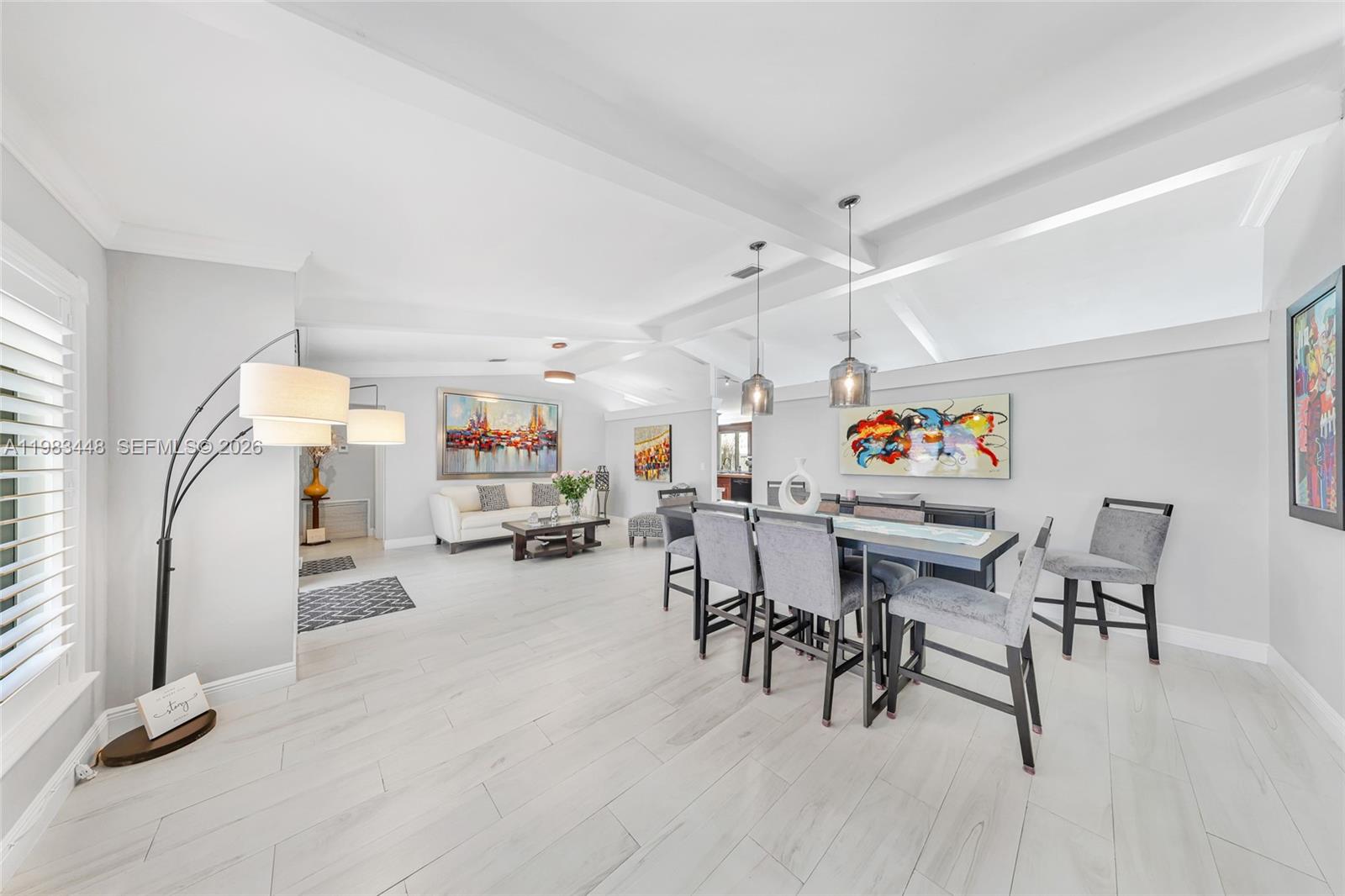 13951 Southwest 109th Street Miami, FL 33186 - Photo 7 of 34 a view of a livingroom with furniture and a flat screen tv