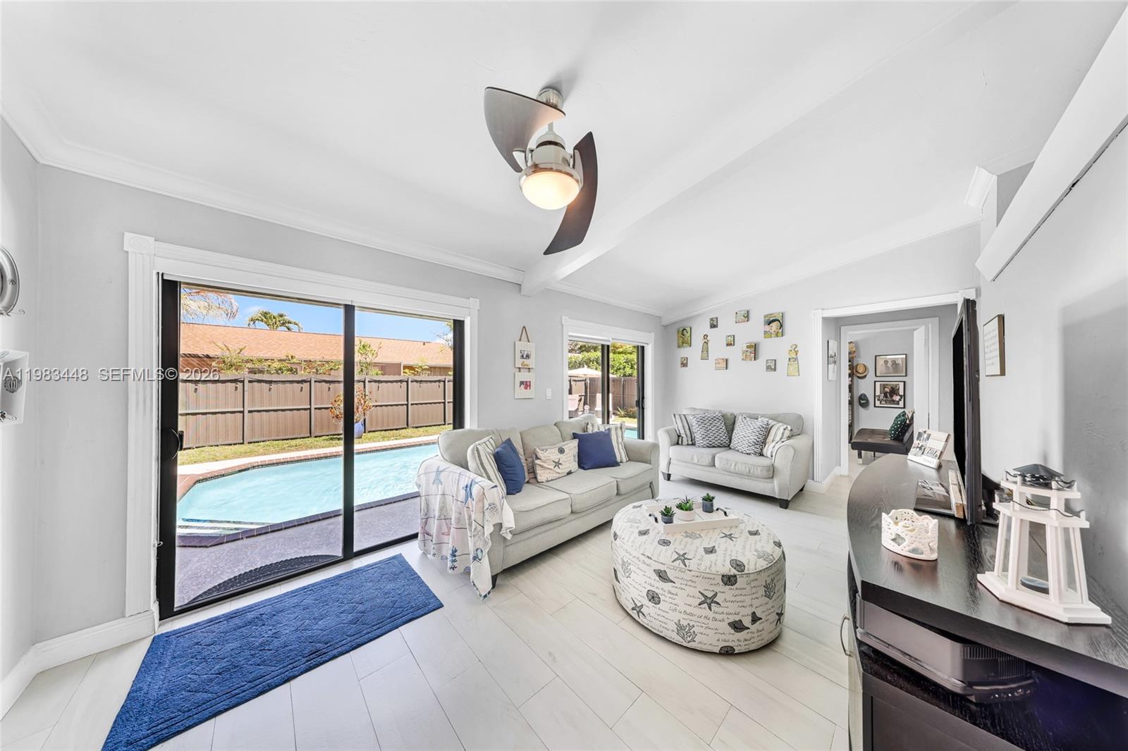 13951 Southwest 109th Street Miami, FL 33186 - Photo 8 of 34 a living room with furniture windows and wooden floor
