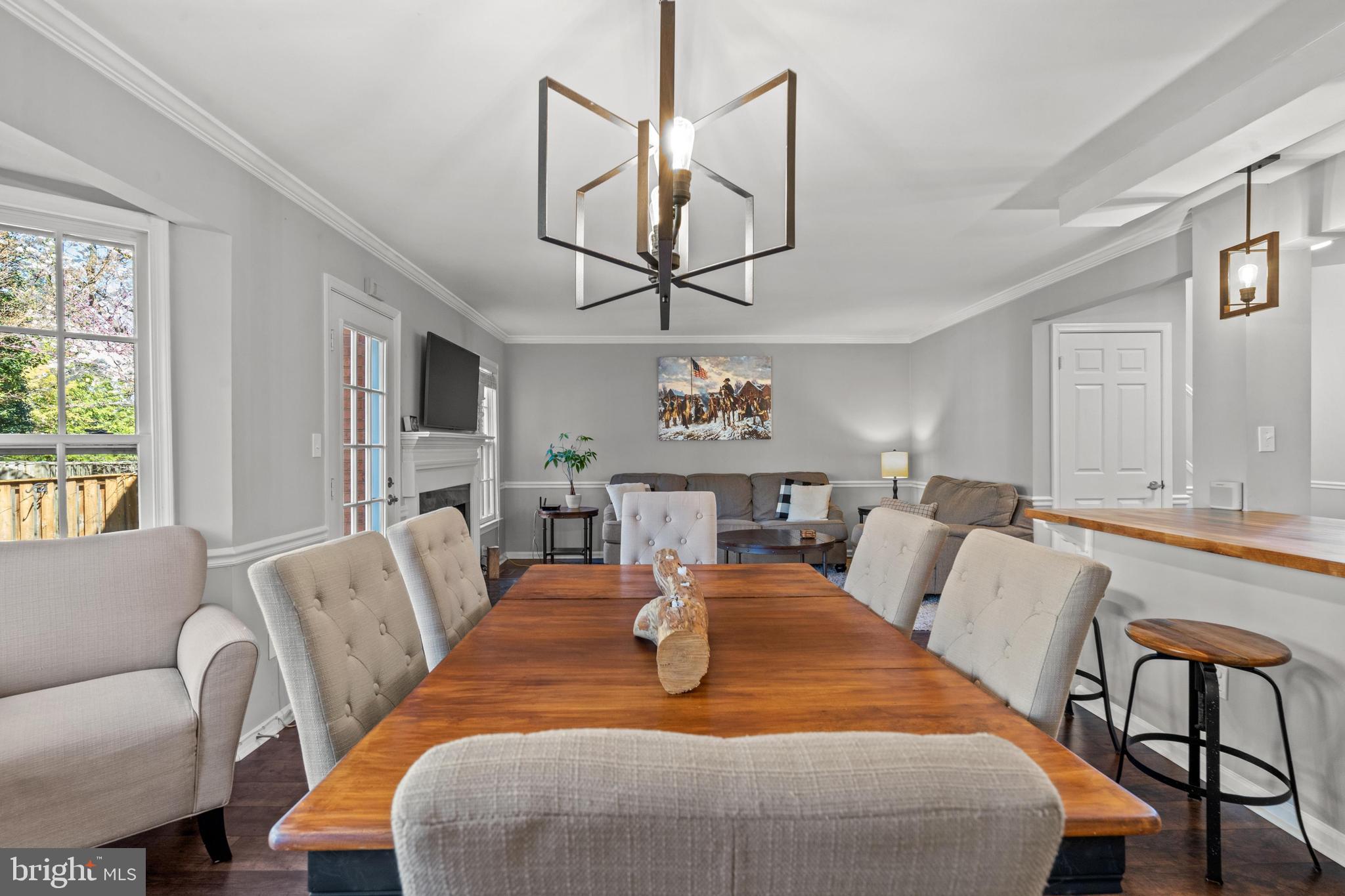1796 Duffield Lane Alexandria, VA 22307 - Photo 13 of 42 a living room with furniture a chandelier and a wooden floor