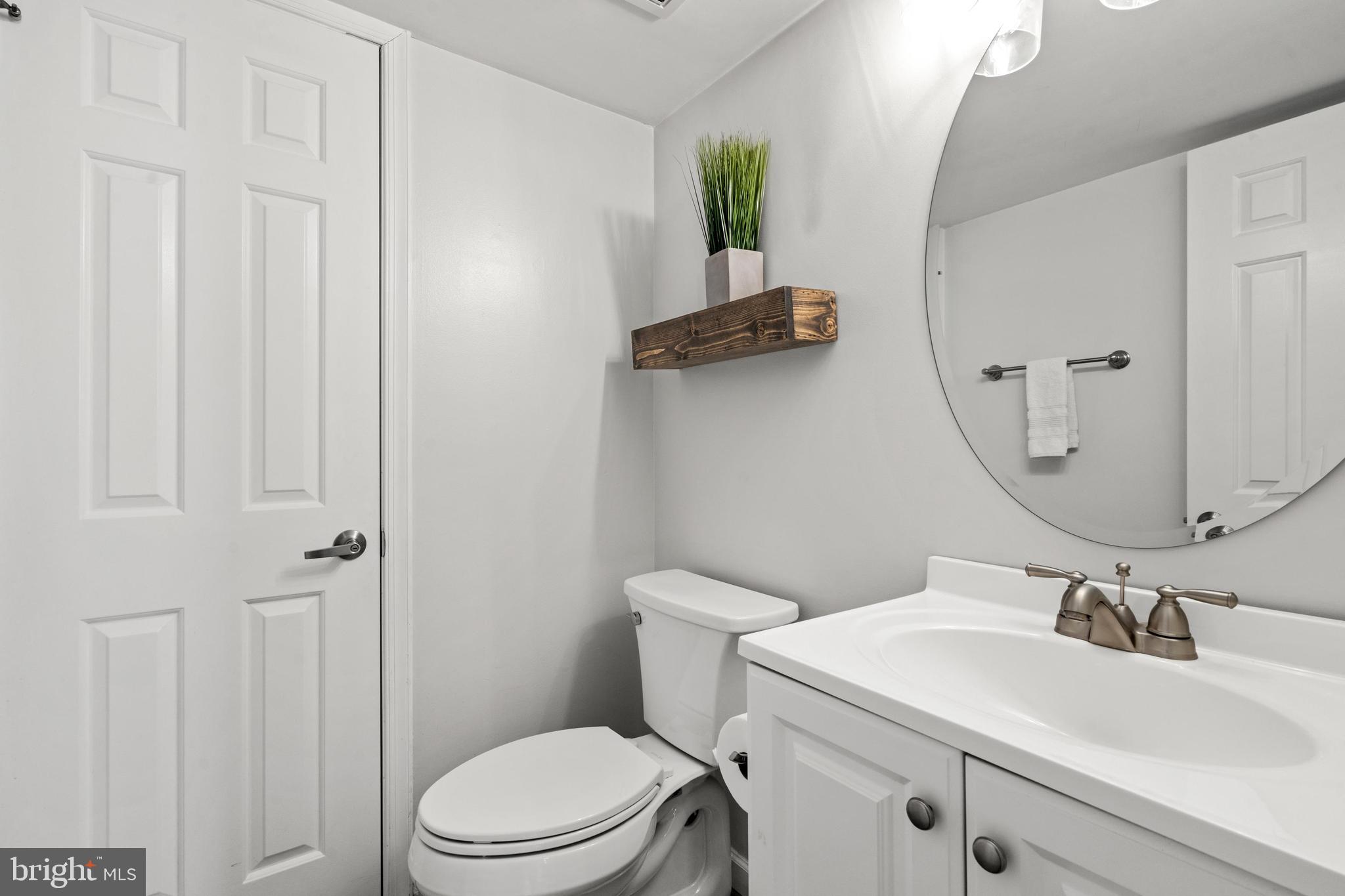 1796 Duffield Lane Alexandria, VA 22307 - Photo 16 of 42 a bathroom with a sink a toilet and a mirror