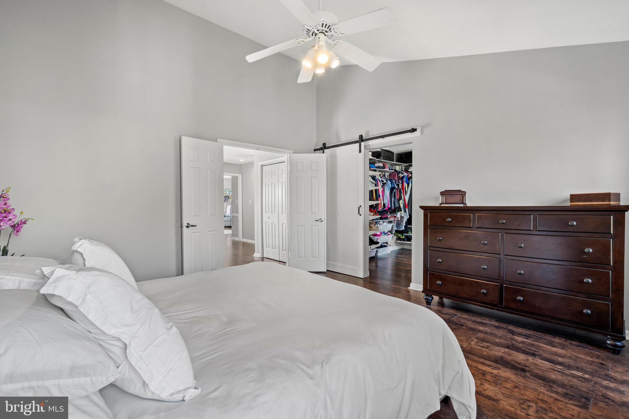 1796 Duffield Lane Alexandria, VA 22307 - Photo 21 of 42 a bedroom with a bed and a chandelier