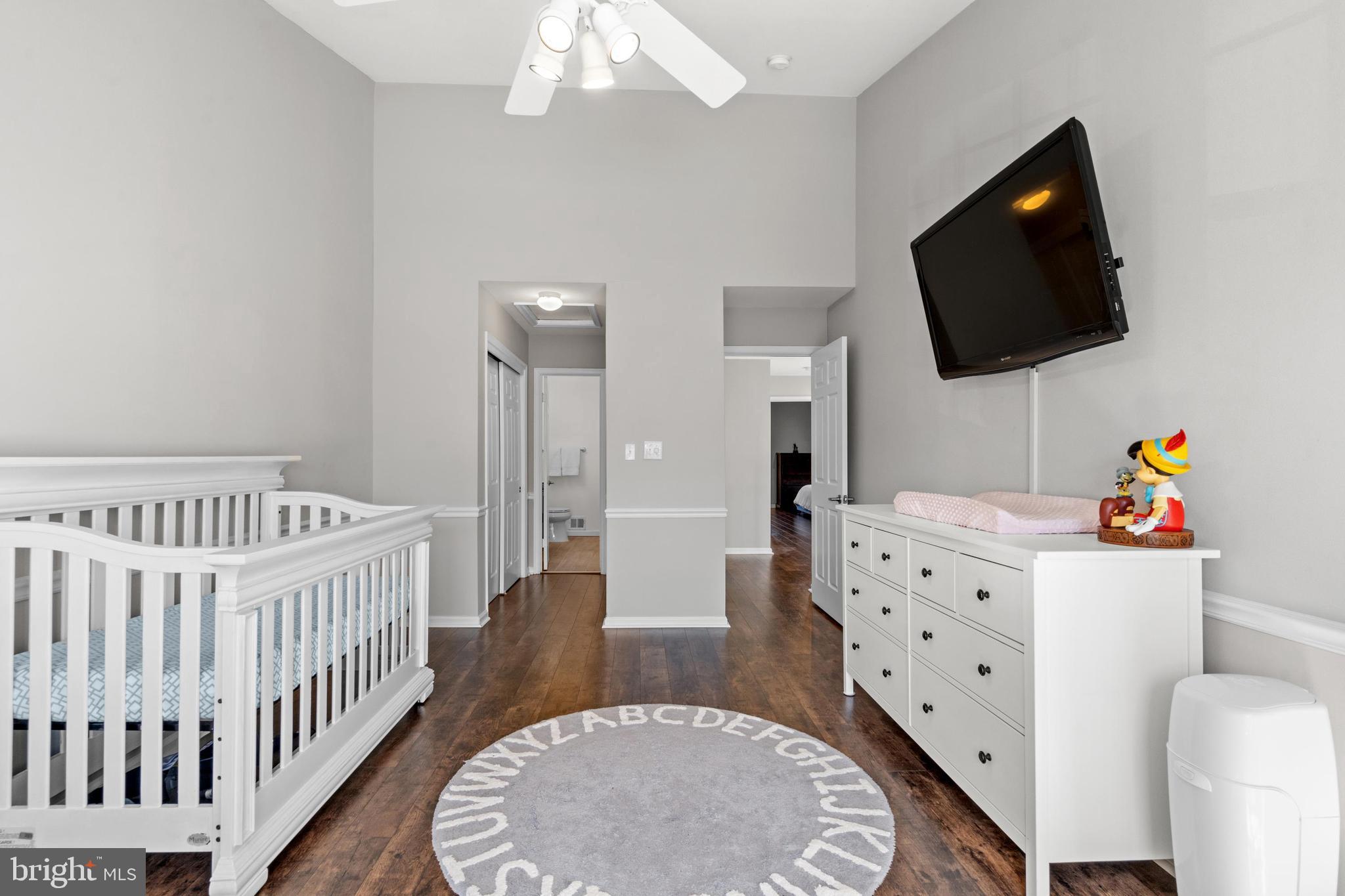 1796 Duffield Lane Alexandria, VA 22307 - Photo 27 of 42 a bedroom with furniture and a flat screen tv