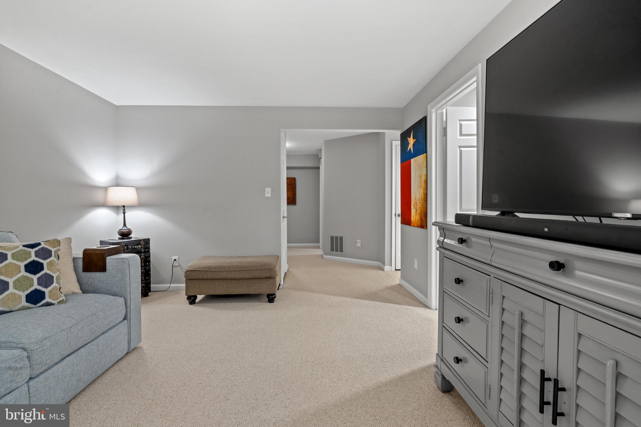 1796 Duffield Lane Alexandria, VA 22307 - Photo 32 of 42 a bedroom with furniture and a flat screen tv