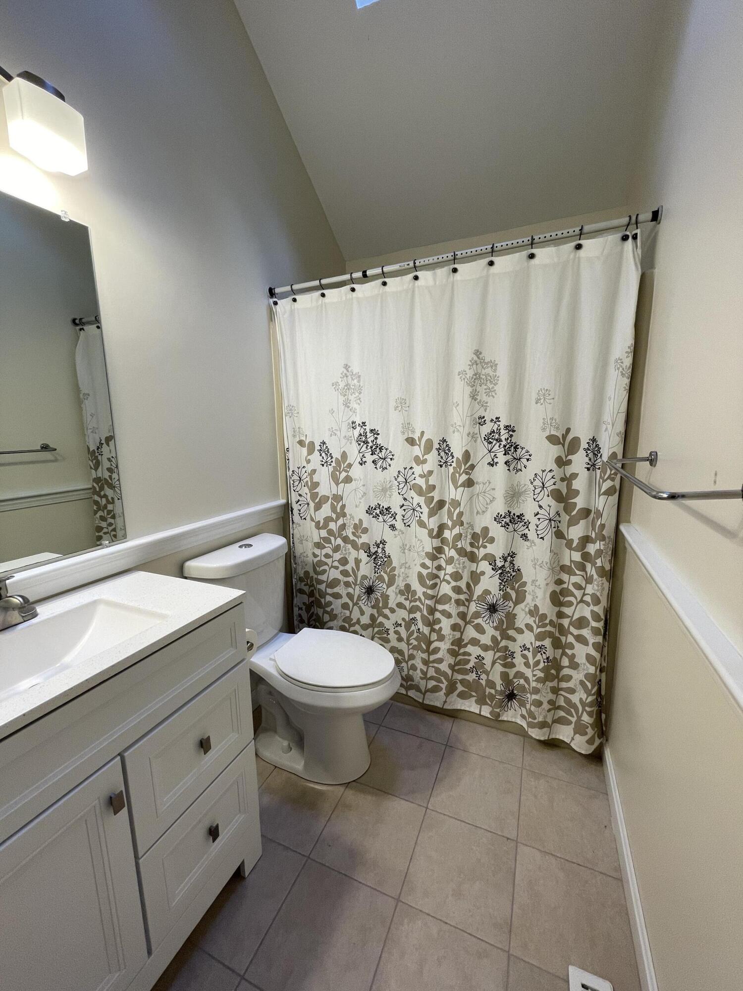 18 Sandy Valley Road Marstons Mills, MA 02648 - Photo 11 of 12 a bathroom with a granite countertop toilet and a sink