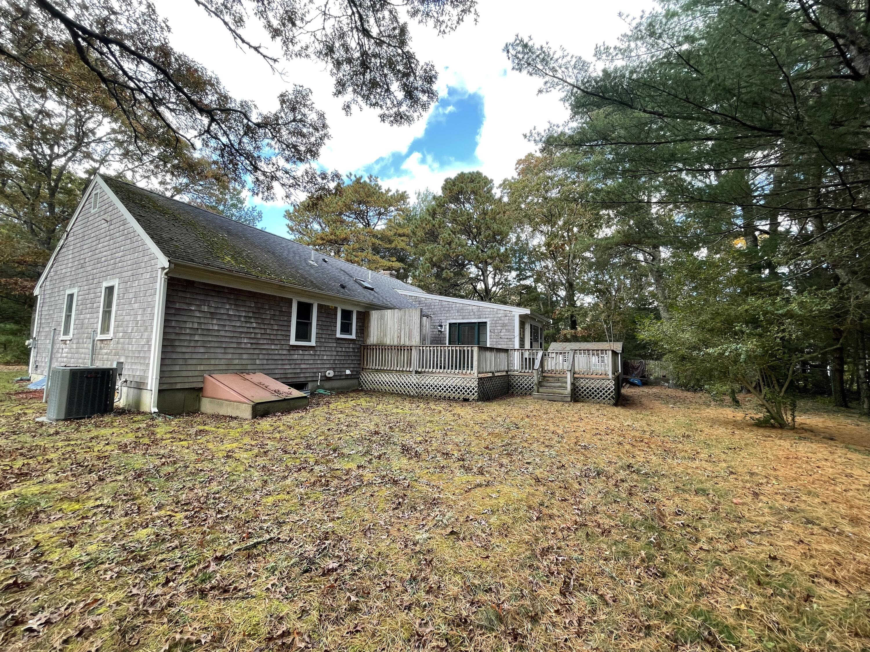 18 Sandy Valley Road Marstons Mills, MA 02648 - Photo 12 of 12 a front view of a house with a yard
