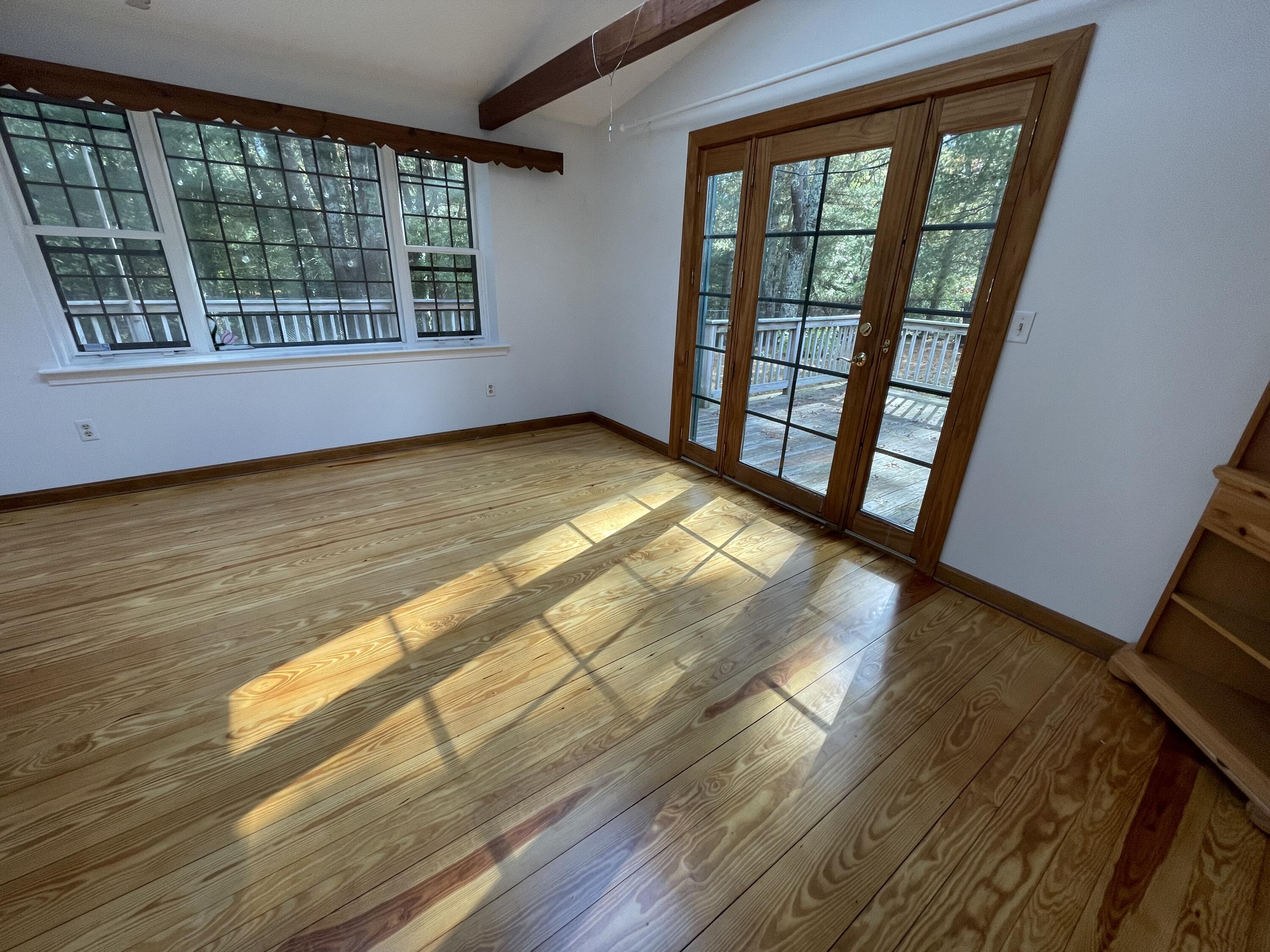 18 Sandy Valley Road Marstons Mills, MA 02648 - Photo 7 of 12 a view of empty room with wooden floor and fan