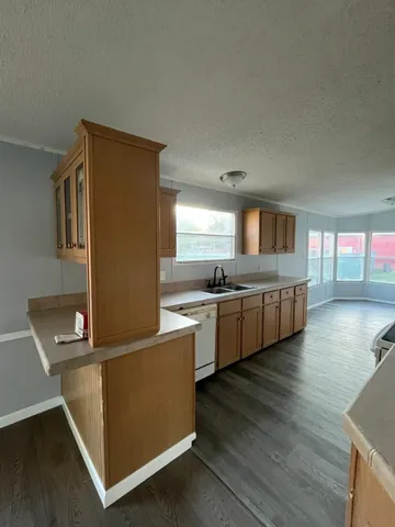 a kitchen with counter top space and appliances