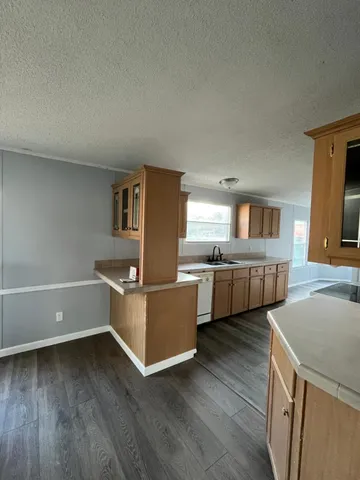 a room with furniture and a wooden floor