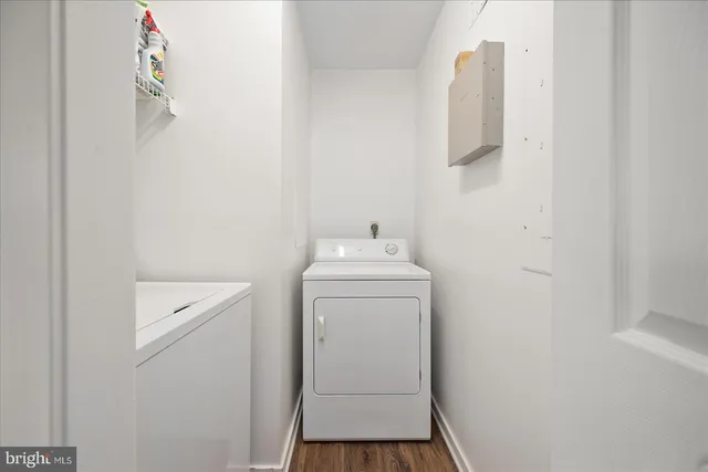 a view of a balcony with wooden floor and outdoor seating