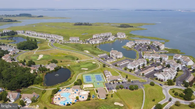 an aerial view of a pool patio yard and outdoor seating