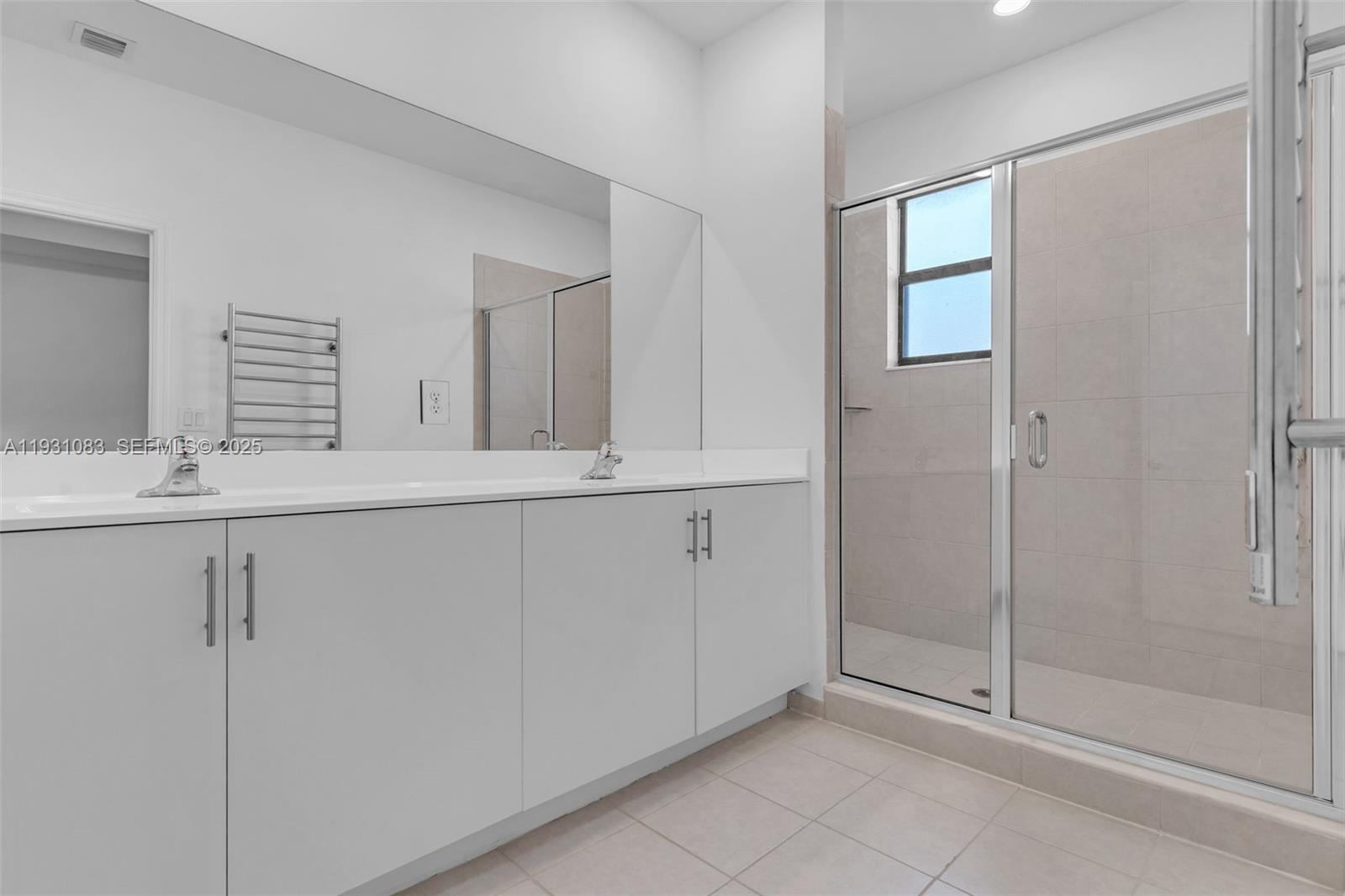 28625 Southwest 133rd Place Homestead, FL 33033 - Photo 14 of 21 a bathroom with a shower sink and mirror