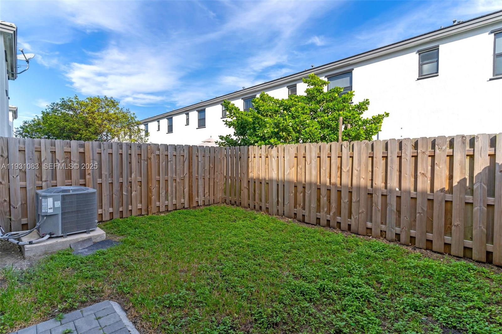 28625 Southwest 133rd Place Homestead, FL 33033 - Photo 18 of 21 a view of a backyard with wooden fence