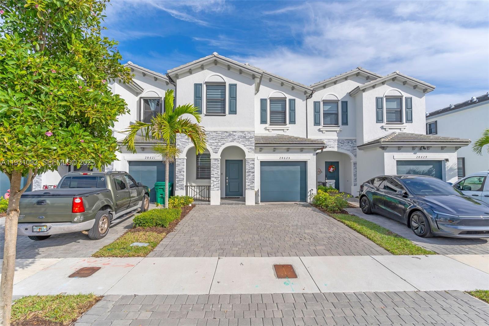 28625 Southwest 133rd Place Homestead, FL 33033 - Photo 19 of 21 a front view of a house with a yard