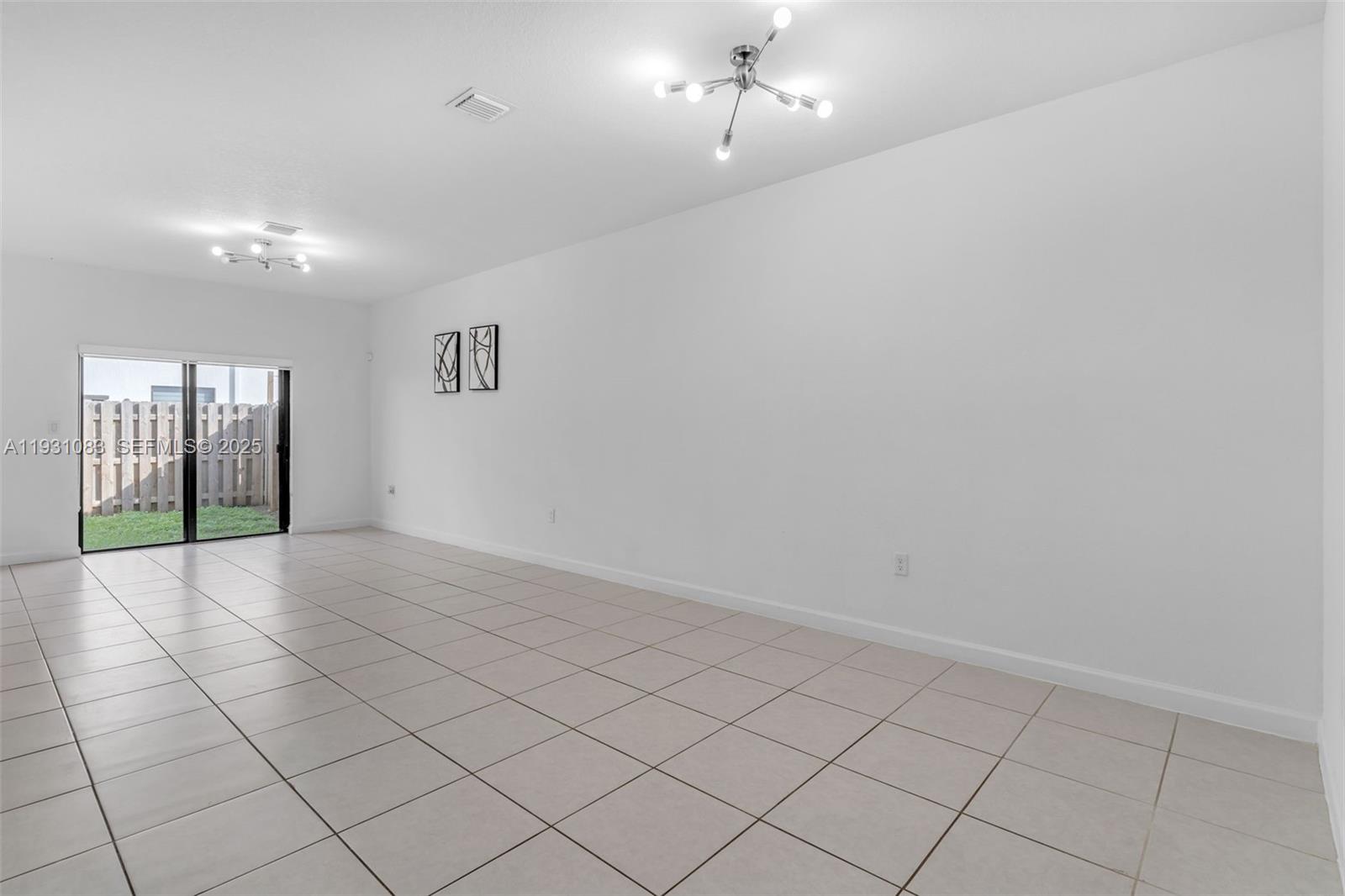 28625 Southwest 133rd Place Homestead, FL 33033 - Photo 5 of 21 a view of an empty room and window