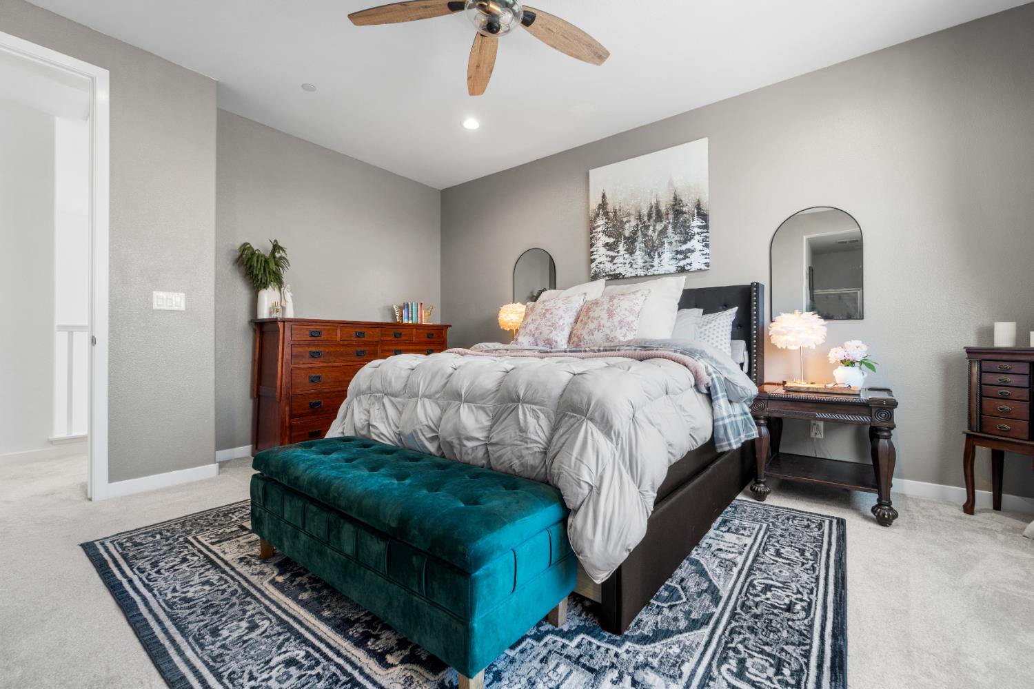 4301 San Miguel Road Madera, CA 93636 - Photo 27 of 60 a bedroom with a bed lamp and a rug