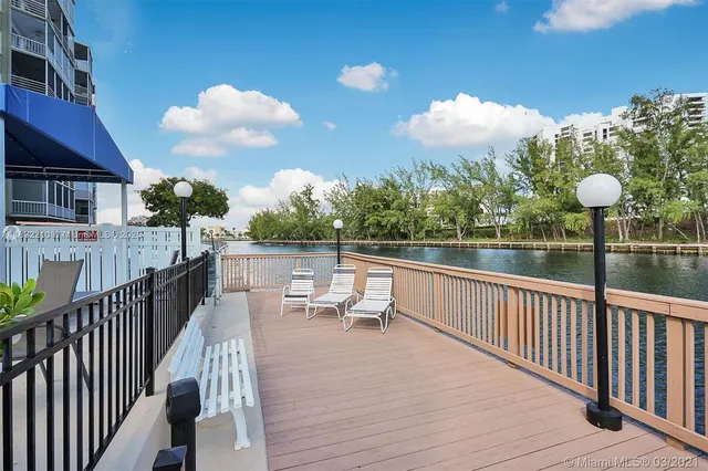 a view of a deck with couches and wooden floor