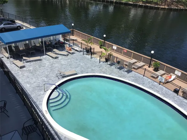 a view of swimming pool from a balcony