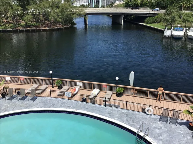 a view of swimming pool with lake view