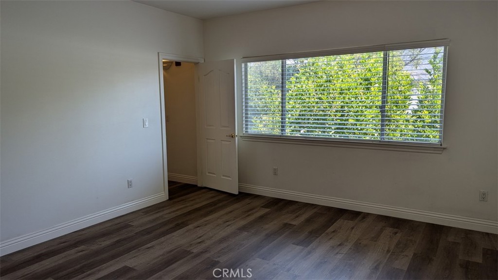255 North Michigan Avenue, Unit 4 Pasadena, CA 91106 - Photo 33 of 39 an empty room with wooden floor and windows