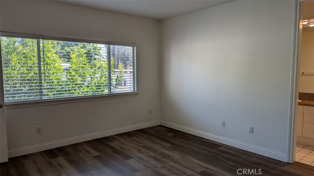 255 North Michigan Avenue, Unit 4 Pasadena, CA 91106 - Photo 34 of 39 a view of an empty room with wooden floor and a window
