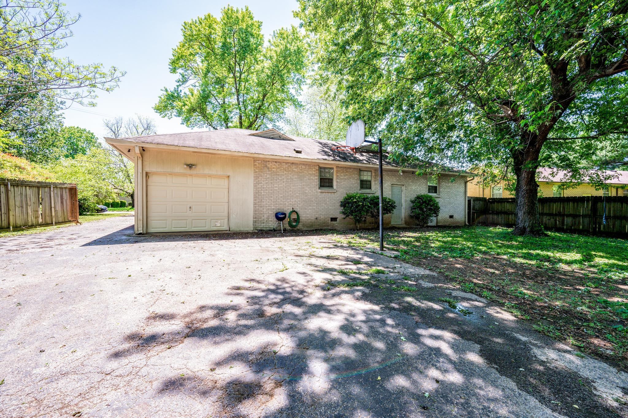 311 Santa Rosa Drive Old Hickory, TN 37138 - Photo 15 of 19 a backyard of a house with plants and tree