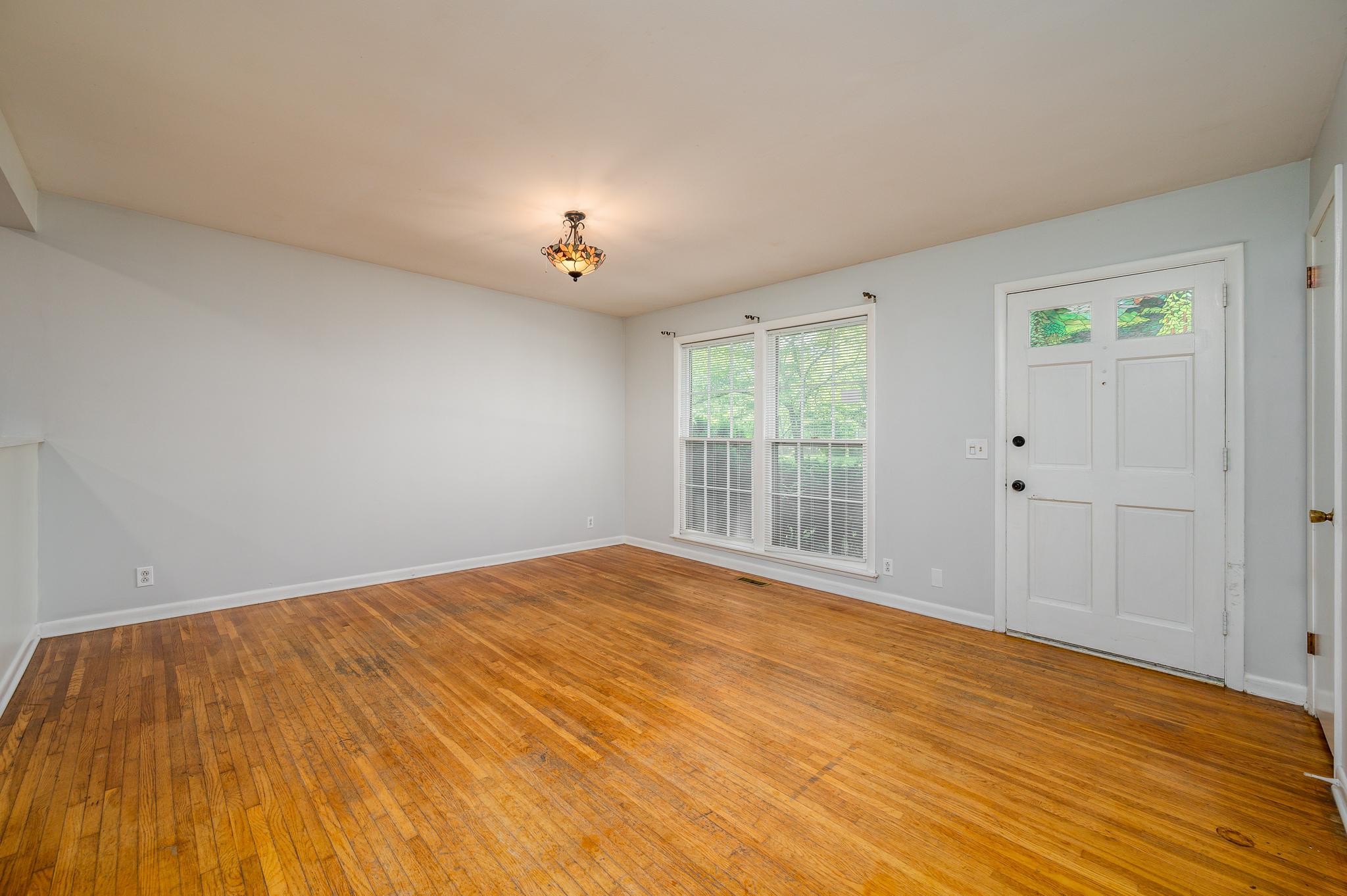 311 Santa Rosa Drive Old Hickory, TN 37138 - Photo 4 of 19 a view of an empty room with wooden floor and a window