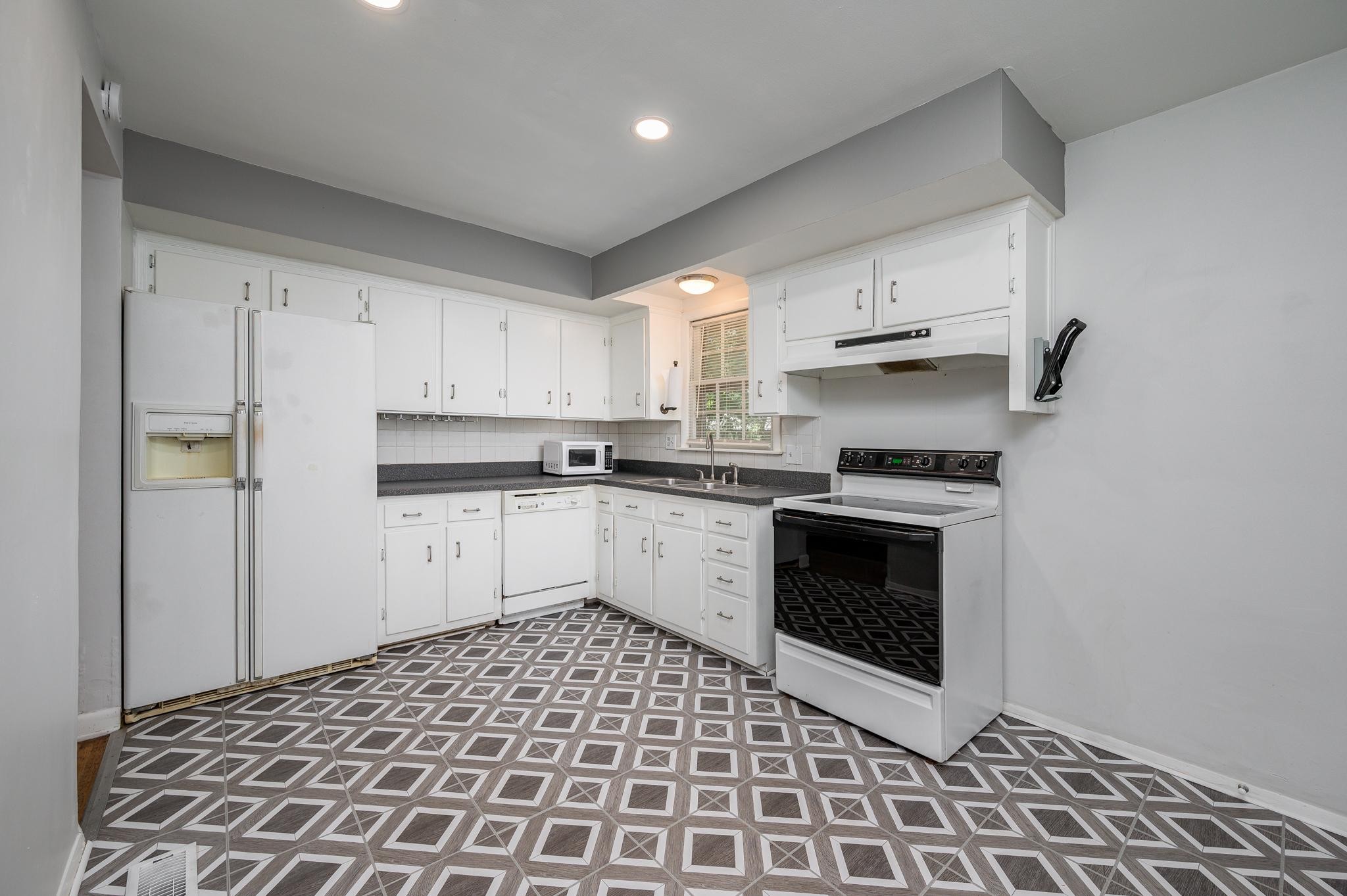 311 Santa Rosa Drive Old Hickory, TN 37138 - Photo 8 of 19 a kitchen with a stove a sink and a refrigerator