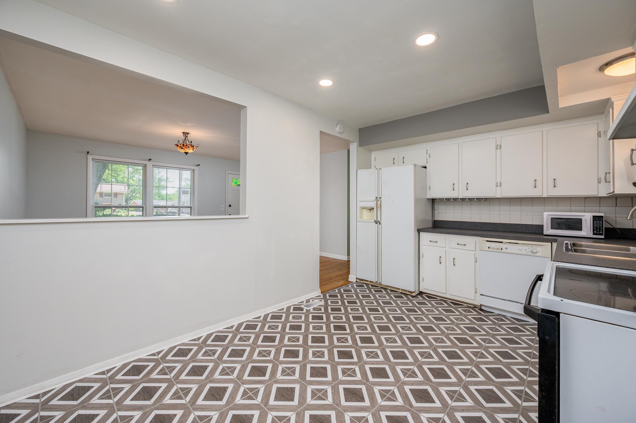 311 Santa Rosa Drive Old Hickory, TN 37138 - Photo 9 of 19 a large white kitchen with a sink and cabinets