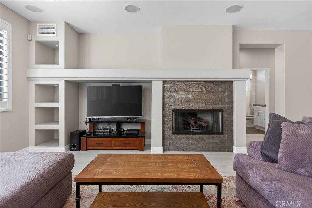 11552 Brookrun Court Riverside, CA 92505 - Photo 18 of 71 a living room with furniture and a fireplace