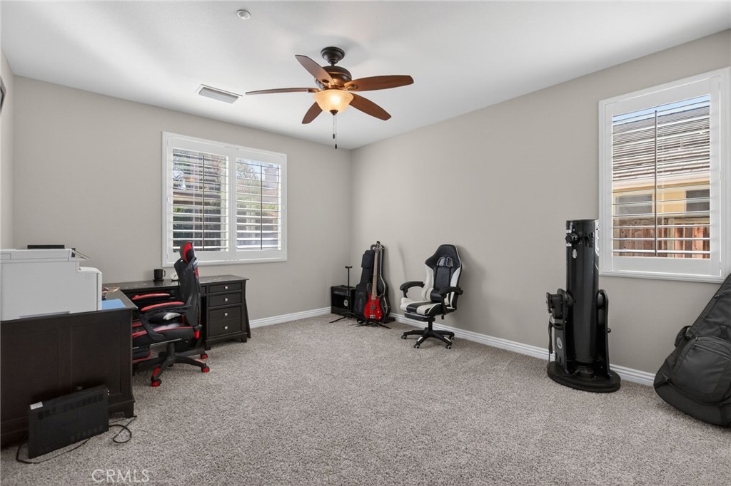 11552 Brookrun Court Riverside, CA 92505 - Photo 19 of 71 a view of a workspace with furniture and a window