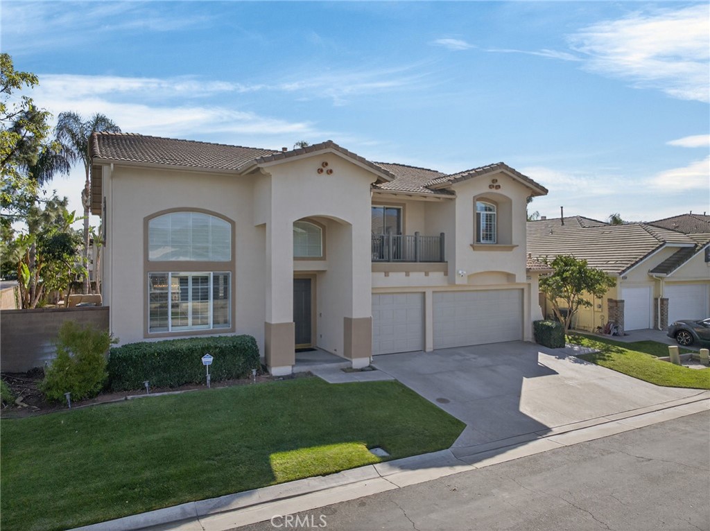 11552 Brookrun Court Riverside, CA 92505 - Photo 3 of 71 a front view of a house with a yard and garage