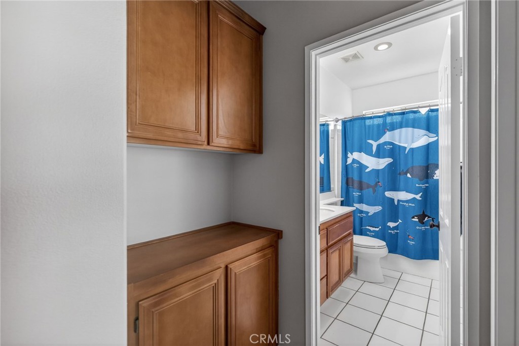 11552 Brookrun Court Riverside, CA 92505 - Photo 37 of 71 a bathroom with a sink and a mirror