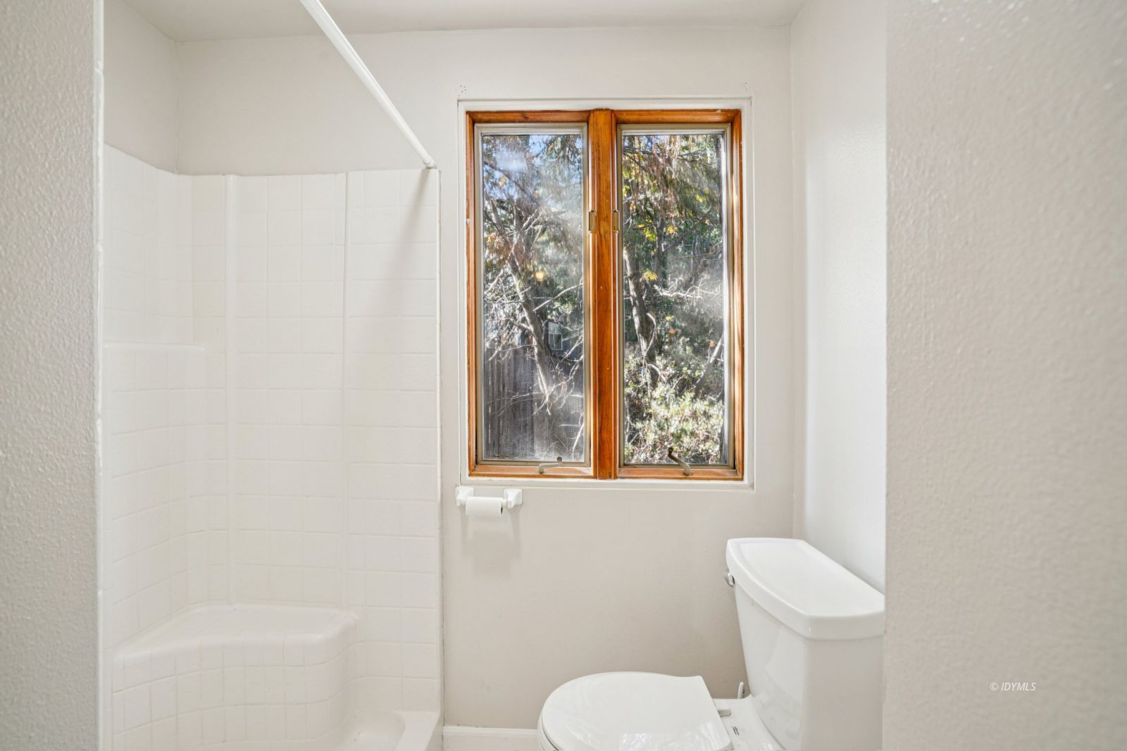 53451 Middleridge Drive Idyllwild, CA 92549 - Photo 18 of 30 a white toilet sitting next to a bathroom sink