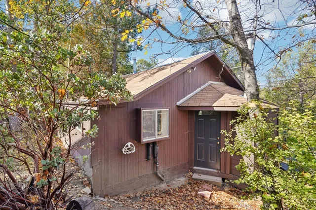 a view of a house with a small yard