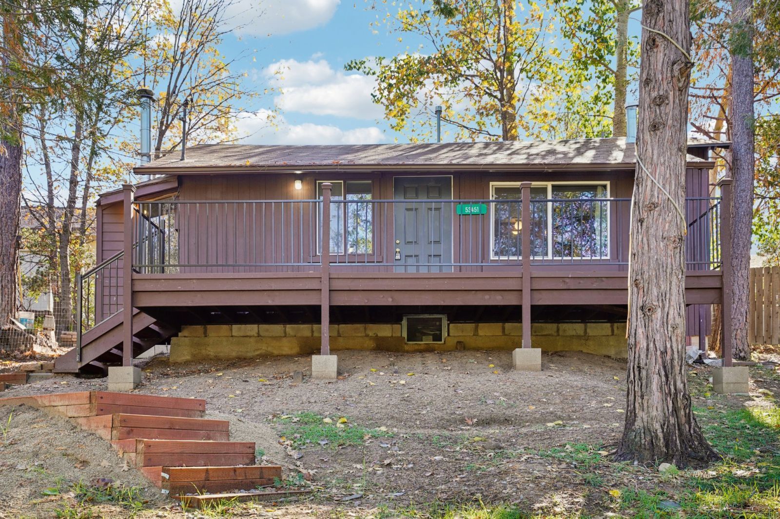 53451 Middleridge Drive Idyllwild, CA 92549 - Photo 26 of 30 a view of a house with a yard and wooden fence